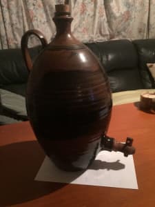 CERAMIC,BROWN BOTTLE WITH HANDLE AND TAP,wineor beer $30
