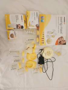 Medela Swing Maxi Double Electric Breast Pump with bottles and accesso