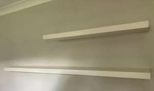 floating shelves white, one 190cm and one at 110cm. Both 26cm wide.