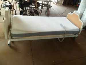 Hospital bed , adjustable heights , remote control , good con