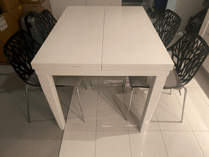 7 pce White extension dining table with 6 black Dining chairs $199 ONO