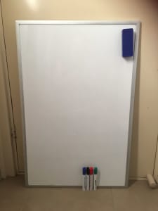 White board with markers and duster