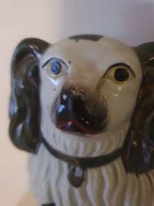 Ceramic spanual dog ornament.