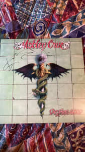 Steve-O signed/Signature Mötley Crüe vinyl.