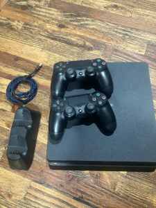 PS4 with 2 controllers and games