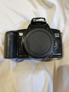 Camera - Canon EOS 35mm with Zoom Lens. 