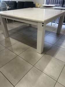 Large square whitewash dining table