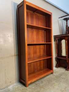 Nearly new dark solid teakwood bookcase with 3 shelves permanent