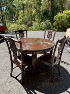 Antique dining room table and chairs with matching sideboard