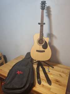Cort acoustic guitar, inbuilt pick up and tuner, stand, bag and strap
