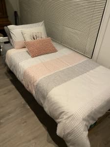 Single white timber bed, mattress & mattress. Protector