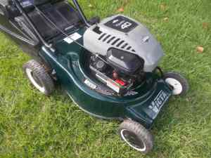 VICTA LAWN MOWER WITH WARRANTY $ 130.