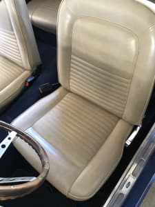 67 Mustang interior- seat covers, door trim, grab handles.