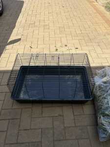 Rabbit cage, food/water tray, hay and food