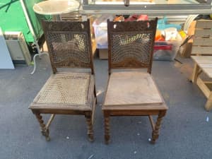 Unique pair of mid century dining chairs with gorgeous wooden carving