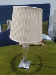 Silver table lamp with pleated cream silk shade