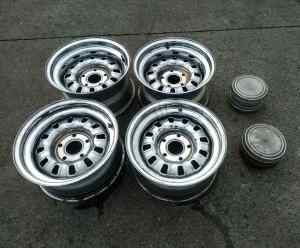 Set of four HQ pattern 15inch 12 slot wheels with centre caps