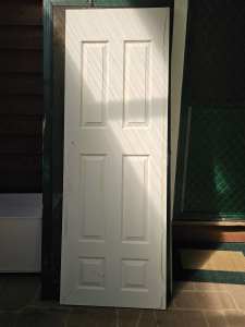 2 wooden doors painted white