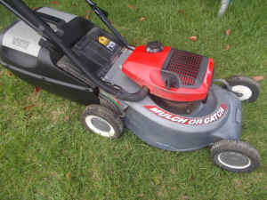 VICTA LAWN MOWER WITH WARANTY. $ 150.