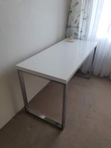 Officeworks white shiny desk with metal frame. Available until Sunday 