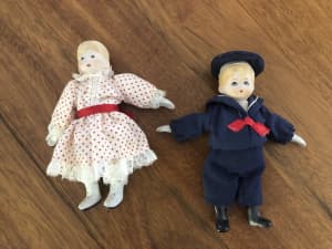 Vintage porcelain girl and boy dolls 