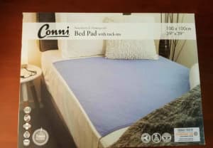 Connie reuseable bed pad with tuck ins-mauve 100 x 100 new in box.