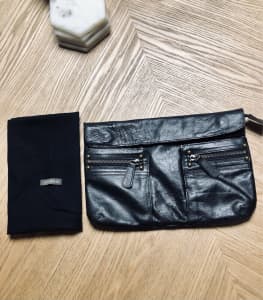 Samvara black leather clutch bag