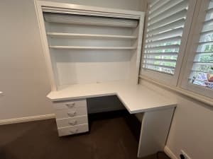 Custom made corner desk unit and shelves with roller door