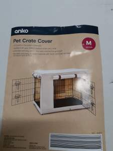 Collapsible pet crate with cover.