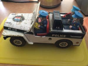 Vintage Police Jeep Tin Collectable toy.