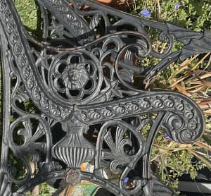 Pair of antique wrought iron park bench ends