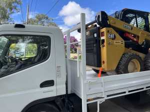 Excavator Skid steer truck with operator