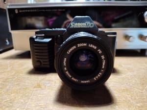 Vintage Canon TL70 Film Camera with lens. Works good. 