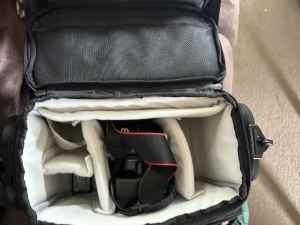 Canon 1100D camera body and bag