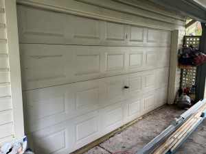 Sectional panel automatic garage door