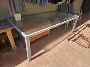 Glass patio dining table and 6 chairs