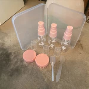 PINK AND CLEAR LIQUID AND LOTIONS TRAVEL SET