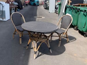 Outdoor dining set with two chairs and a round table 