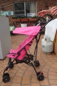 Baby stroller, pink and folds straight... in Revesby