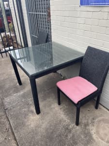 Rattan style table with glass top and 2 chairs