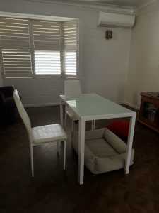White Glass dining table and four chairs included.