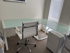 Glass desk. Easy to pull apart and put together for pick up