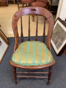 Beautiful mid century dining chair with yellow and green seat cushion