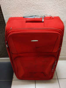 Big suitcase red colour Samsonite brand two wheels for sale