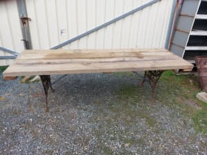Table, solid timber with cast iron legs