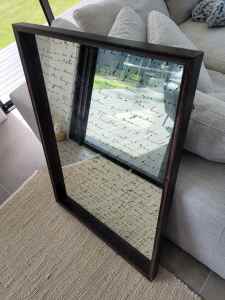 Framed mirror with italic stencilled writing