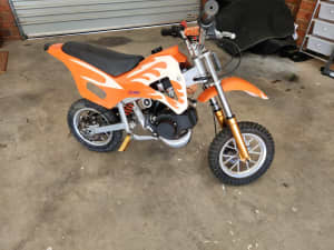 49cc pit bike with helmet and fuel