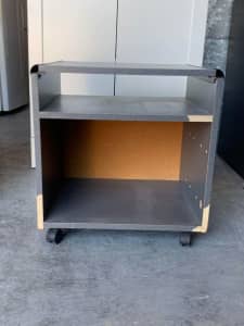 Small movable TV stand with the top shelf 