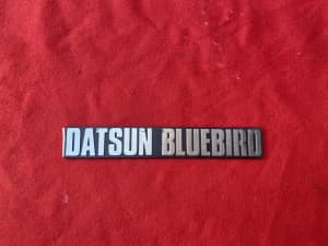 NOS DATSUN BLUEBIRD BADGE 
