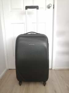 A 4 wheel Hardshell/Medium Size Suitcase for Sale